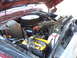 1978 Ford Bronco - The engine bay of a 1978 Ford Bronco shows its V8 engine with aftermarket air filter and a yellow Optima battery.
