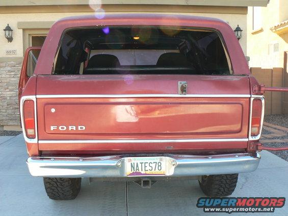 Rear view of red 1978 Ford Bronco with license plate NAT ES78