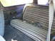 1978 Ford Bronco - Rear bench seat and interior panel of a 1978 Ford Bronco.