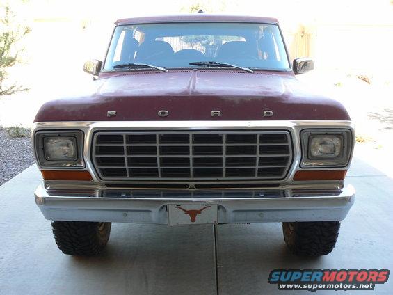 Maroon 1978 Ford Bronco front view, chrome grille, Texas Longhorns license plate frame