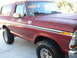 1978 Ford Bronco - This 1978 Ford Bronco features a prominent chrome side trim and aggressive off-road tires.