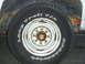 1978 Chevrolet C/K Pickup - Close-up of a BFGoodrich Long Trail T/A tire and a rusty wheel on a vehicle.