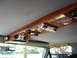 1992 Ford C-350 (Centurion Conversions) - Custom overhead console with integrated audio system and wood accents.