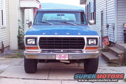 Front view of a blue 1979 Ford Bronco with a "Firefighter" plate