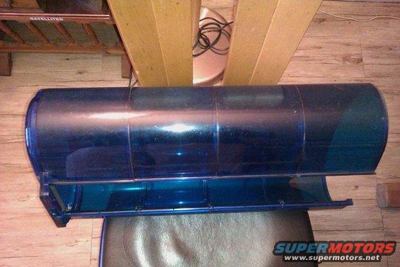 Blue plastic police light bar with metal mounting brackets