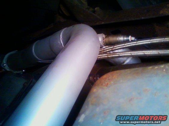 Exhaust pipe with oxygen sensor and braided lines