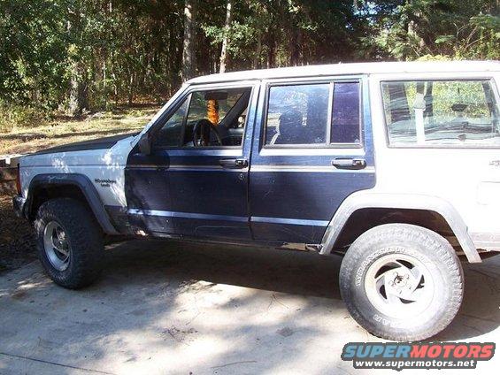 1992 Jeep Cherokee side profile, showing two-tone paint and aftermarket wheels