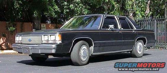 Black 1980s Ford sedan, 3/4 front view