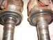 1996 Ford F-150 - Two front axle shafts, likely from a 4x4 vehicle, are shown in this close-up view.