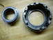 1996 Ford F-150 - Two metal differential components are shown, one with external teeth and the other with internal splines.