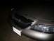 1997 Lincoln Mark VIII - The front fascia of a car is visible, a dark grille and a license plate.