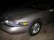 1997 Lincoln Mark VIII - Front corner view of a 1997 Lincoln Mark VIII, showing the headlight and wheel.