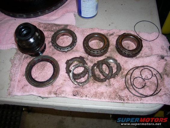 Vehicle differential bearings and seals laid out on a pink towel