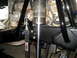 1996 Ford Bronco - Close-up of aftermarket suspension parts, including a shock and tie-down strap.