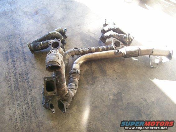 exhaust manifold and downpipe assembly, wrapped in heat insulation