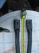 1981 Ford Bronco - Two black metal parts are measured with a tape measure, with a watermark for SuperMotors.net visible.