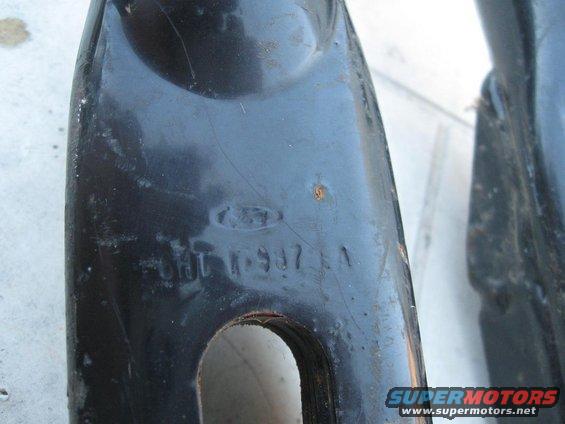 Black metal part with Ford logo and stamped numbers CHT 11-937 1A