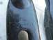 1981 Ford Bronco - Close-up of a black metal part showing a Ford logo and stamped identification numbers.