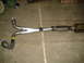1996 Ford Bronco - Exhaust Y-pipe assembly with catalytic converter and muffler shown on concrete floor.