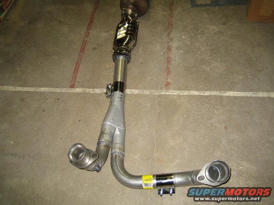 Exhaust Y-pipe with catalytic converter, metal flanges, and yellow sticker