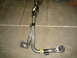 1996 Ford Bronco - An exhaust Y-pipe with a catalytic converter is shown on a concrete floor.