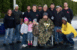 1992 Ford Mustang - A group of people gathered at a drag strip, with one person holding a trophy.