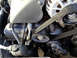2001 Mercury Grand Marquis - Close-up view of the serpentine belt and pulleys within an engine compartment.