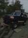 1992 Ford Bronco - This 1992 Ford Bronco is equipped for off-roading with large tires and auxiliary lights on the roof rack.