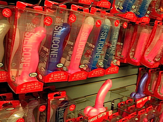 Rows of silicone adult toys in packaging and on display