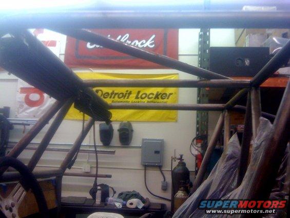 Roll cage construction with Detroit Locker banner in background