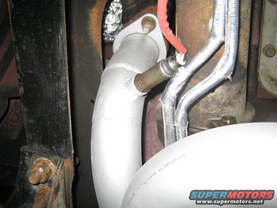 exhaust pipe with oxygen sensor and heat-shielded wires