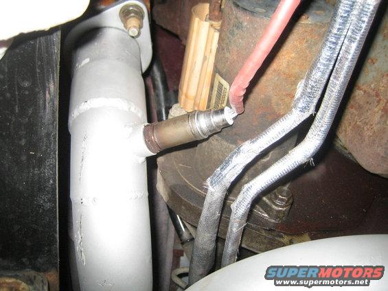 Exhaust pipe with oxygen sensor and heat-shielded wires