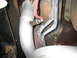 1996 Ford Bronco - Exhaust pipe and oxygen sensor detail, likely from a vehicle's undercarriage.