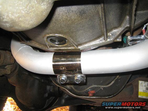 Exhaust pipe with a chrome clamp and two bolts