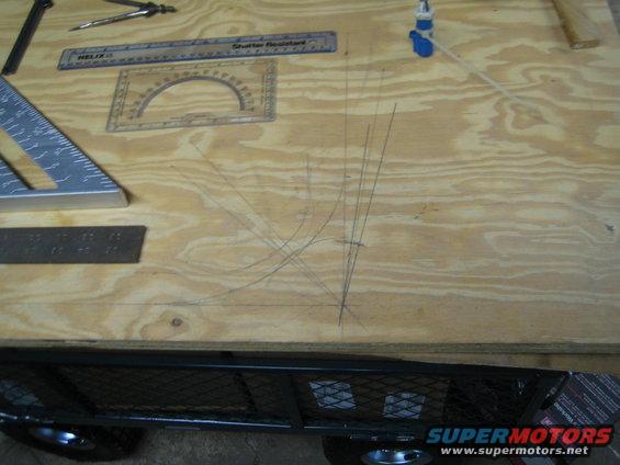 Drawing tools on plywood with pencil lines and a protractor