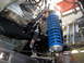1996 Ford Bronco - Close-up of a blue coilover shock absorber and suspension hardware.