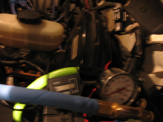 95-ac-compressor-pics-049.jpg the little &quot;curtis&quot; hour meter gauge I put in line to monitor &quot;on&quot; time for the compressor so it would help me determine the next time for some grease.  meter only runs when the switch is flipped on in the cab (it's also switched power so requires the key on) AND the pressure switch is open and sending power to the compressor clutch.  The meter has some ability to maintain the clock internally when off and cannot be reset.