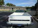 1973 Ford Ranchero - The rear of a white 1972 Ford Ranchero pickup truck is visible in a parking lot.