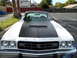 1973 Ford Ranchero - This 1973 Ford Ranchero features a distinctive black hood stripe and scoop, seen from a front-facing perspective.