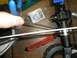 1994 Ford Escort - Close-up of an RC car's rear differential and suspension components during assembly.