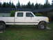 1984 Ford Bronco - This white crew cab pickup truck appears to be from the early 1980s, not a 1984 Ford Bronco.