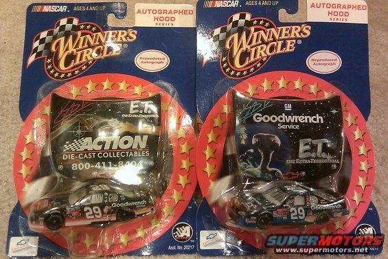 Two Winners Circle die-cast collectible race cars, one with E.T. and Action Die-Cast Collectibles branding, the other with E.T. and Goodwrench Service branding