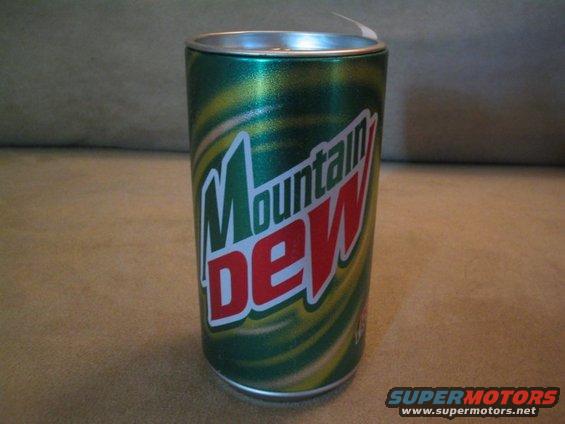Mountain Dew can on a textured surface