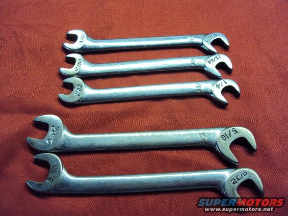 Set of six combination wrenches with fractional inch sizes stamped on them