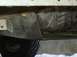 1986 Ford F-150 - Close-up of the underside of a vehicle, focusing on the transmission and frame components.