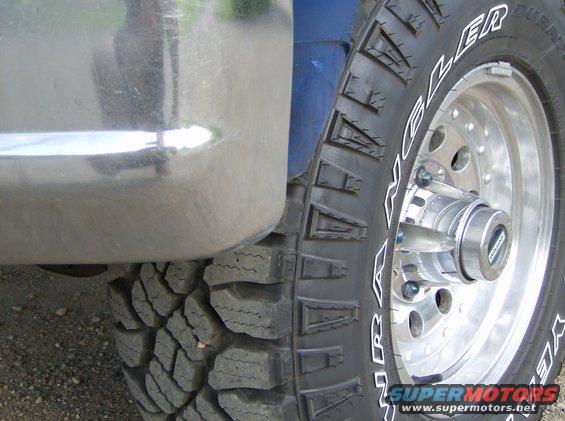 Chrome bumper and tire with 'WRANGLER' text