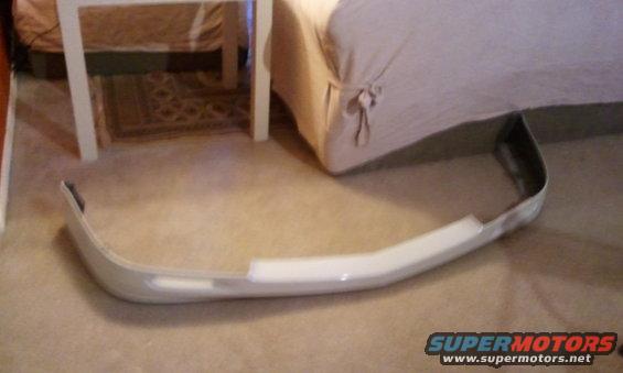 White front bumper part on carpet