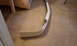 2003 Acura TL - A white car bumper part is shown on a carpeted floor.