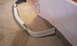 2003 Acura TL - A white car bumper is shown on a carpeted surface, partially covered by a light-colored cloth.