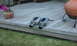 2003 Acura TL - Pair of exhaust mufflers on a deck, possibly for a car.